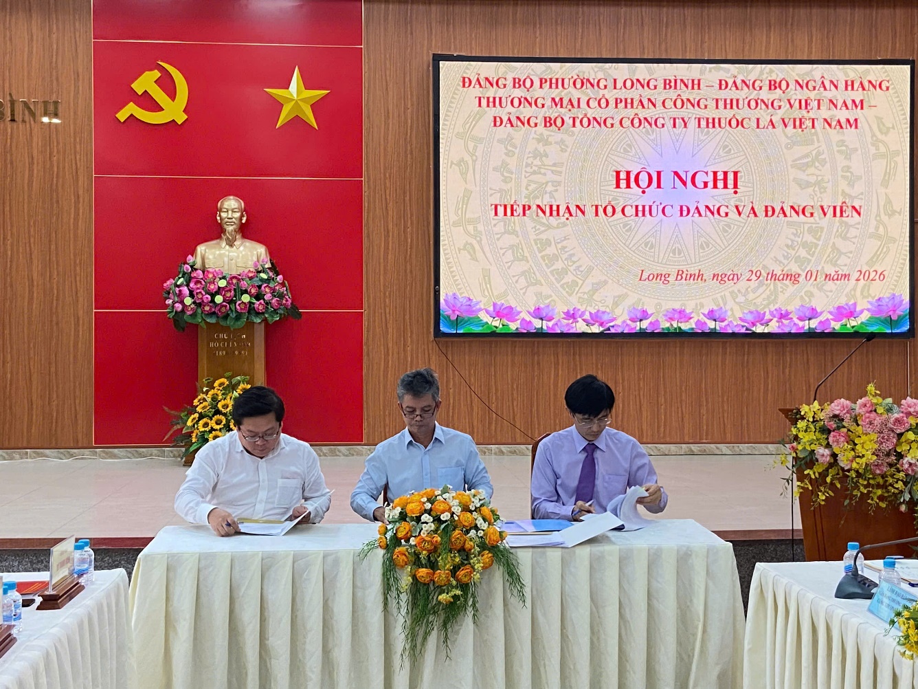 '''A group of people sitting at a table

Description automatically generated'''